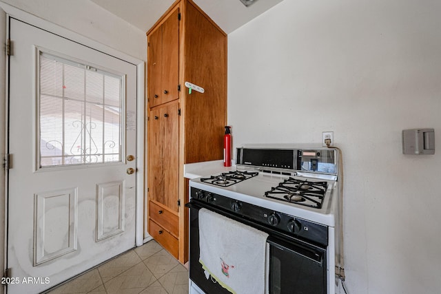 kitchen featuring white gas range