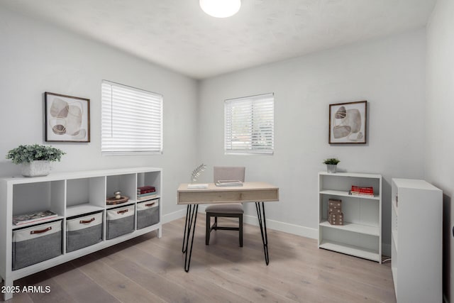 office area featuring wood finished floors and baseboards