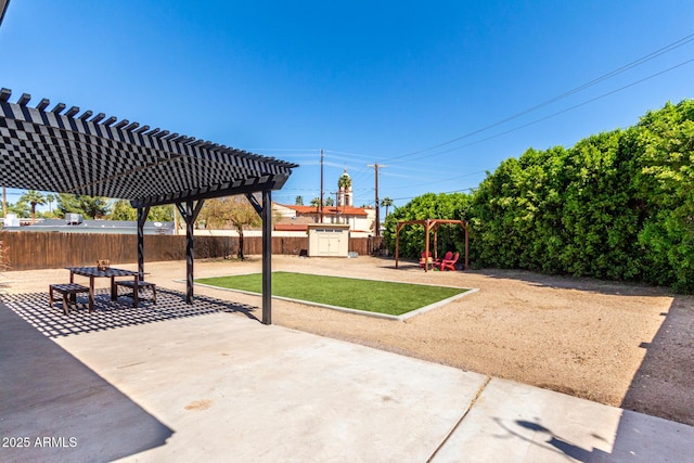 view of patio with a pergola, a fenced backyard, and playground community