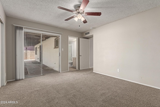 unfurnished bedroom with connected bathroom, ceiling fan, a textured ceiling, a closet, and carpet