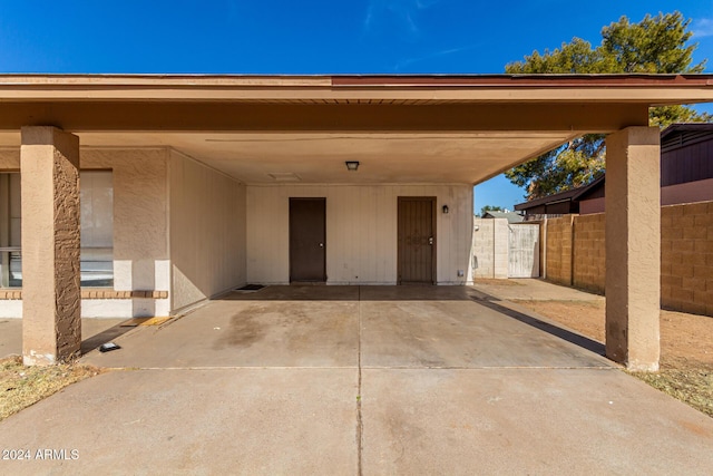 doorway to property with a carport