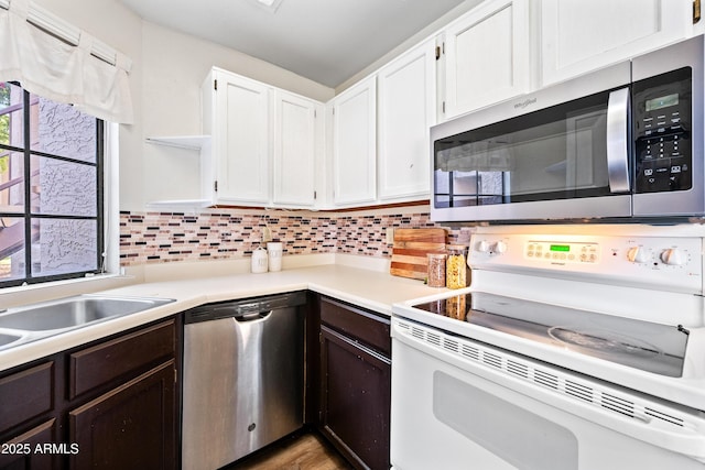 930 N Mesa Dr Unit 1079, Mesa, AZ 85201 - kitchen featuring dark brown cabinets, open shelves, white cabinetry, light countertops, and appliances with stainless steel finishes