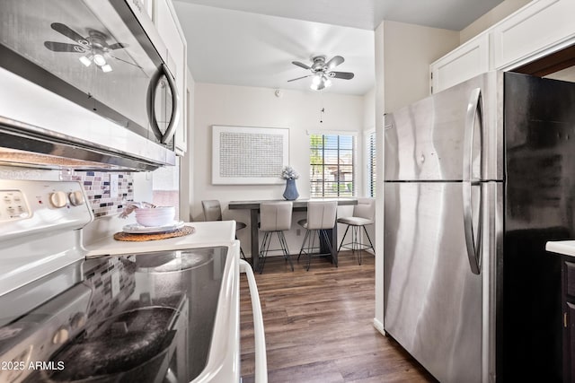 930 N Mesa Dr Unit 1079, Mesa, AZ 85201 - kitchen with stainless steel appliances, dark wood finished floors, white cabinetry, light countertops, and a ceiling fan