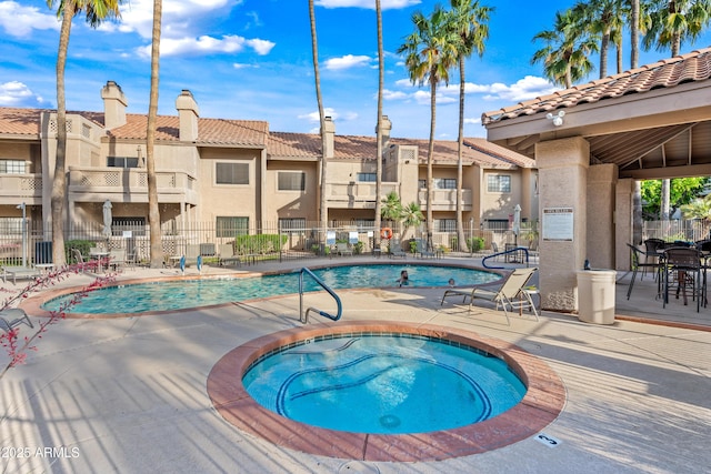 930 N Mesa Dr Unit 1079, Mesa, AZ 85201 - community pool with a patio area, fence, a community hot tub, and a residential view
