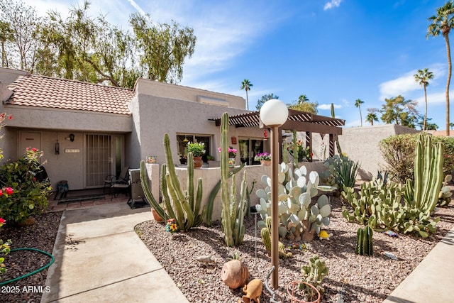 southwest-style home with a pergola