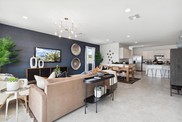 living room with an inviting chandelier