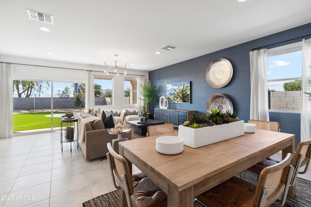 tiled dining room with a wealth of natural light