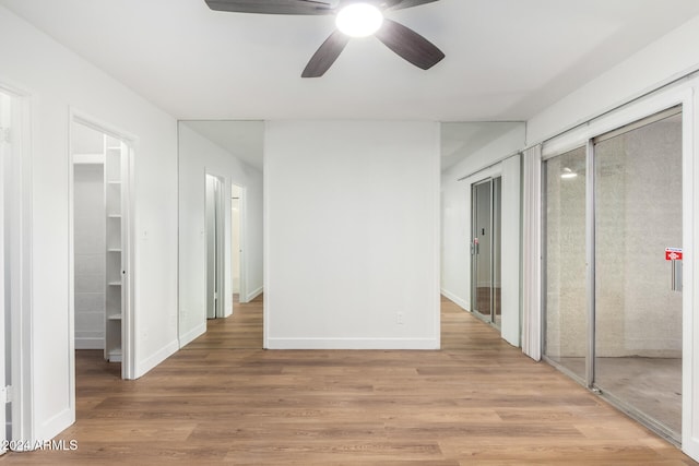 unfurnished bedroom featuring ceiling fan and hardwood / wood-style floors