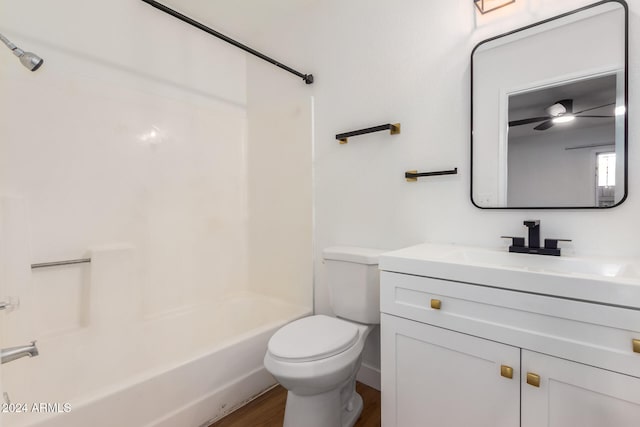 full bathroom featuring ceiling fan, vanity, bathtub / shower combination, wood-type flooring, and toilet