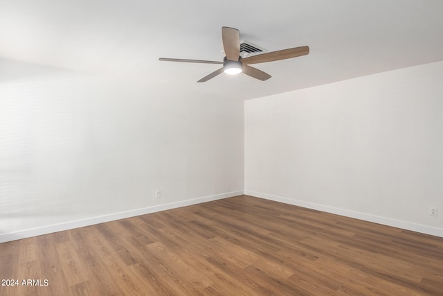 unfurnished room with ceiling fan and hardwood / wood-style flooring