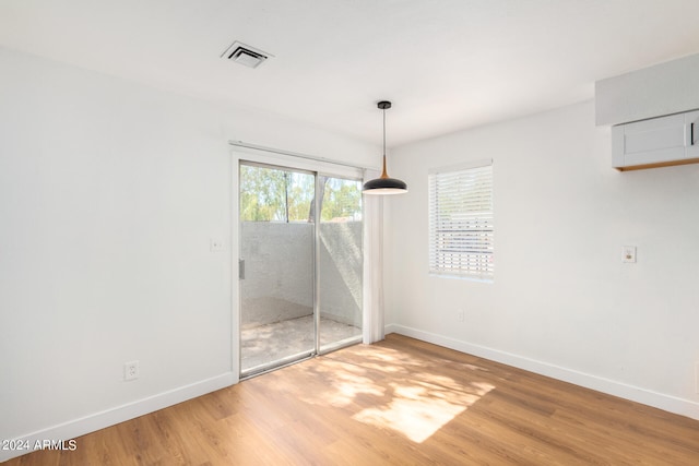 empty room featuring hardwood / wood-style flooring