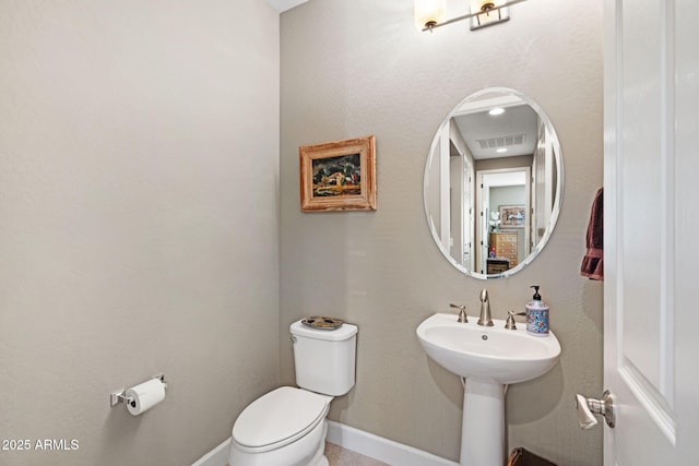 bathroom featuring toilet