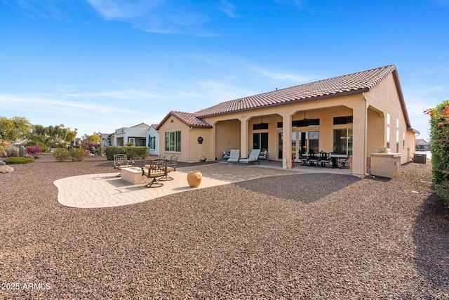 rear view of house featuring a patio