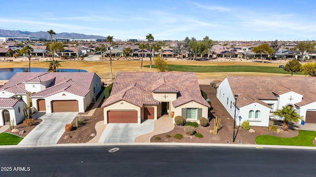 view of front facade featuring a mountain view and a garage