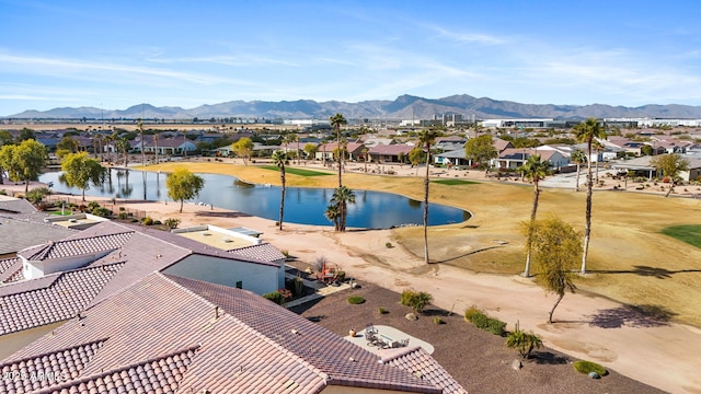 exterior space with a water and mountain view