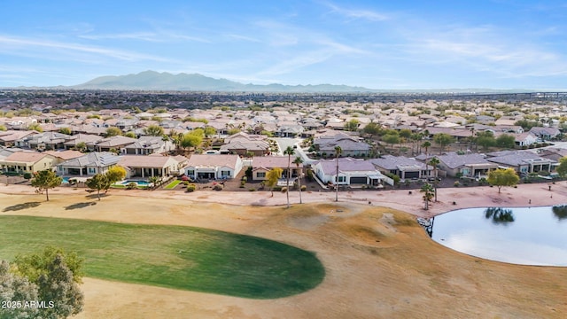 drone / aerial view with a water and mountain view