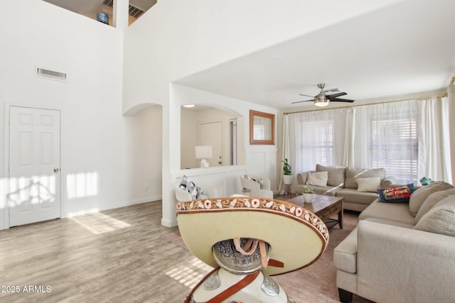 living room featuring hardwood / wood-style flooring and ceiling fan