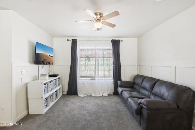 living room with carpet floors and ceiling fan