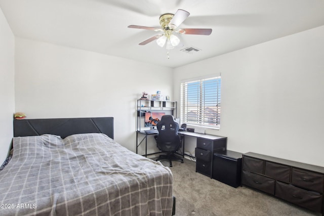 bedroom with ceiling fan and light carpet