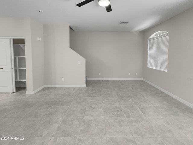 unfurnished room featuring ceiling fan and light tile patterned flooring