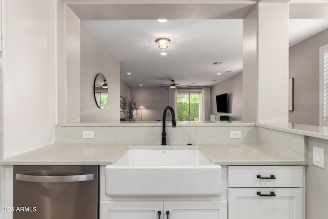 6550 S 24th Pl, Phoenix, AZ 85042 - kitchen featuring dishwasher, a sink, ceiling fan, white cabinets, and light countertops