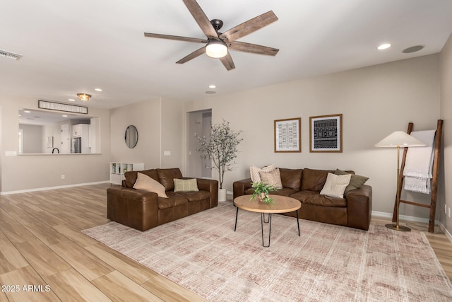 6550 S 24th Pl, Phoenix, AZ 85042 - living room with ceiling fan, wood finished floors, baseboards, and recessed lighting