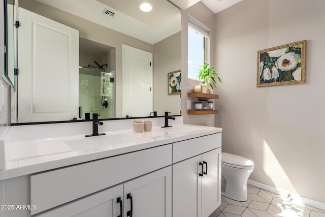 6550 S 24th Pl, Phoenix, AZ 85042 - bathroom featuring toilet, double vanity, baseboards, a shower, and recessed lighting