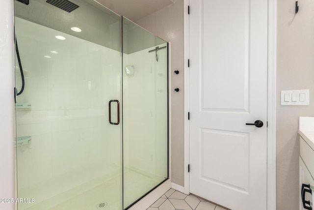6550 S 24th Pl, Phoenix, AZ 85042 - full bath featuring a shower stall, vanity, recessed lighting, tile patterned floors, and baseboards