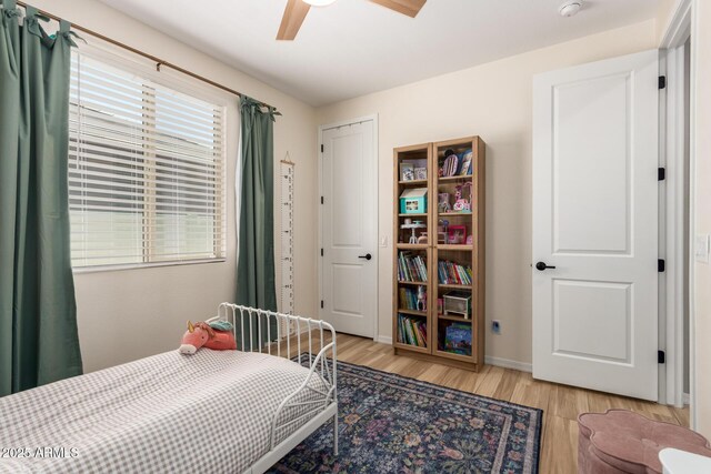 6550 S 24th Pl, Phoenix, AZ 85042 - bedroom with light wood finished floors, baseboards, and ceiling fan