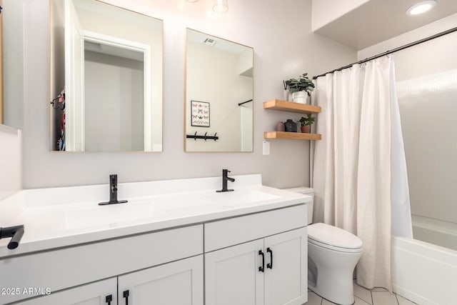 6550 S 24th Pl, Phoenix, AZ 85042 - bathroom featuring toilet, double vanity, shower / tub combo with curtain, and tile patterned floors