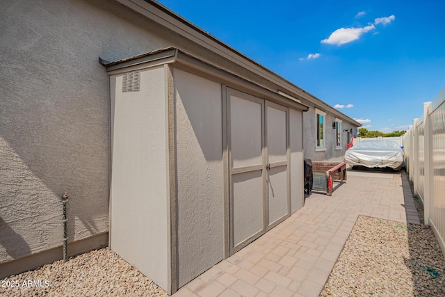 6550 S 24th Pl, Phoenix, AZ 85042 - view of side of home featuring stucco siding and a patio