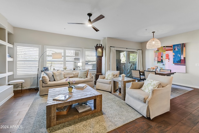 living room featuring dark hardwood / wood-style flooring and ceiling fan