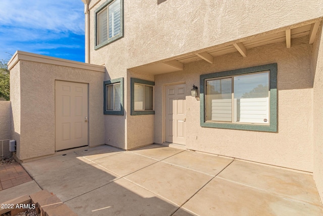 doorway to property featuring a patio