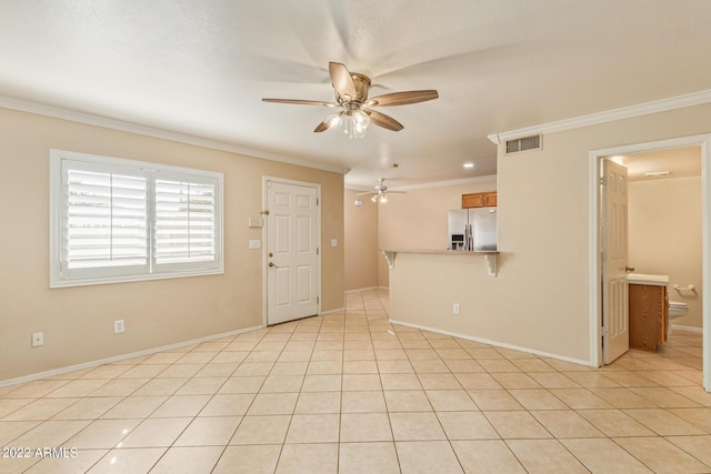 unfurnished living room featuring ceiling fan, ornamental molding, and light tile patterned flooring