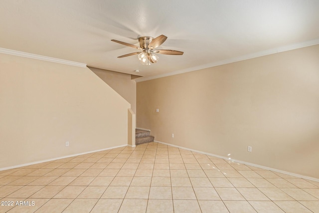 empty room featuring ceiling fan, ornamental molding, and light tile patterned floors