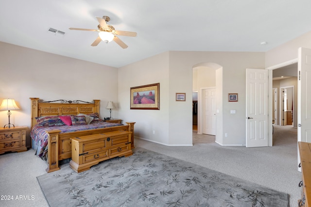 bedroom with ceiling fan and light colored carpet