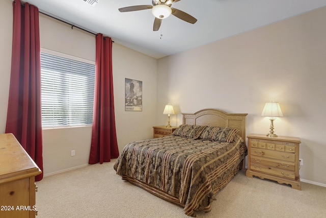 bedroom featuring ceiling fan and light colored carpet