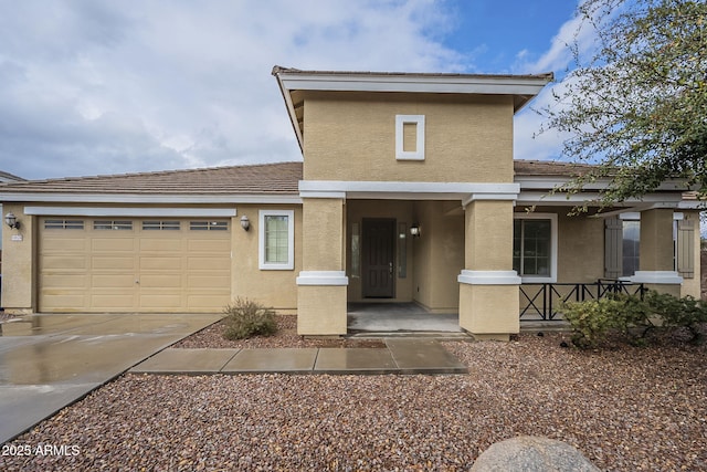 view of front of home featuring concrete driveway, a garage, covered porch, and stucco siding