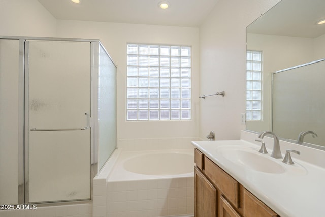 full bath with recessed lighting, a garden tub, a stall shower, and vanity