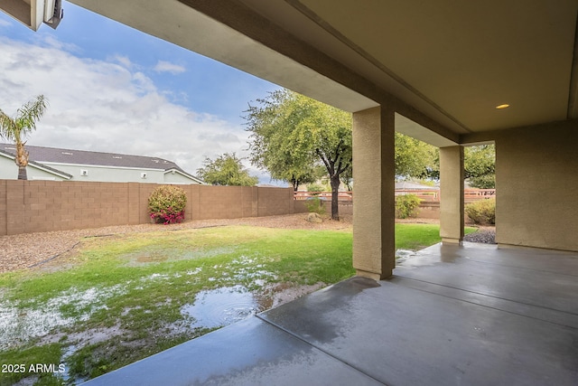 view of yard with a fenced backyard and a patio area