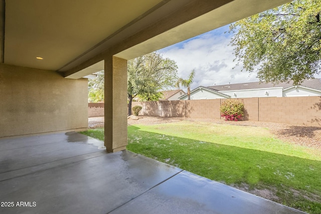 view of yard featuring a patio area and a fenced backyard