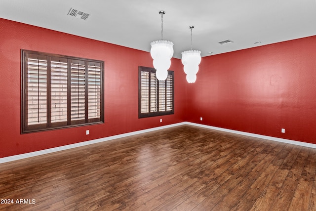 interior space with hardwood / wood-style flooring and an inviting chandelier