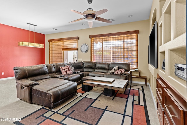 living room featuring tile patterned floors and ceiling fan