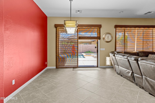 interior space with light tile patterned floors and a wealth of natural light