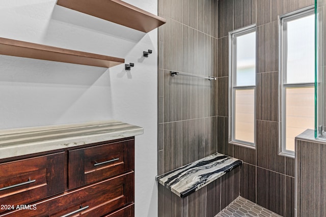 bathroom featuring a tile shower