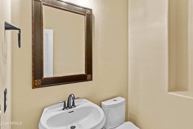 bathroom featuring sink and toilet