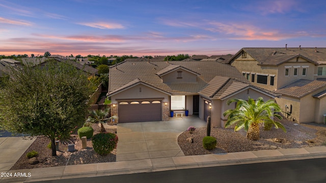 view of front of property featuring a garage