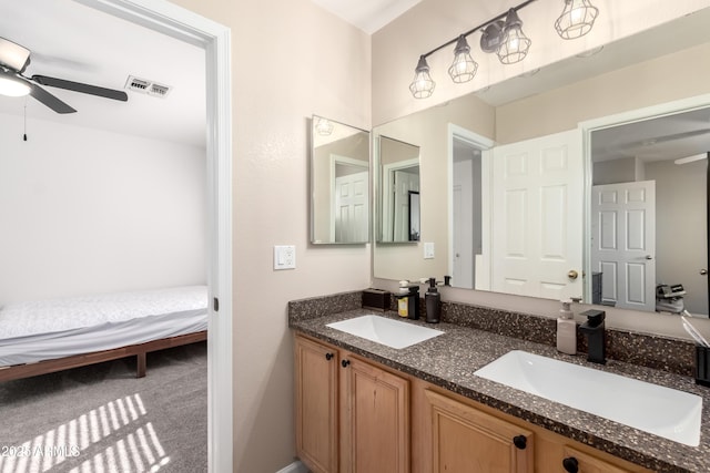 8637 W Kathleen Rd, Peoria, AZ 85382 - bathroom featuring double vanity, ensuite bathroom, a ceiling fan, and a sink