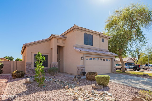 8637 W Kathleen Rd, Peoria, AZ 85382 - view of front of house with stucco siding, stone siding, concrete driveway, an attached garage, and a tiled roof