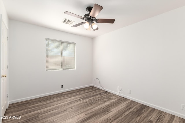 8637 W Kathleen Rd, Peoria, AZ 85382 - unfurnished room featuring visible vents, baseboards, wood finished floors, and a ceiling fan